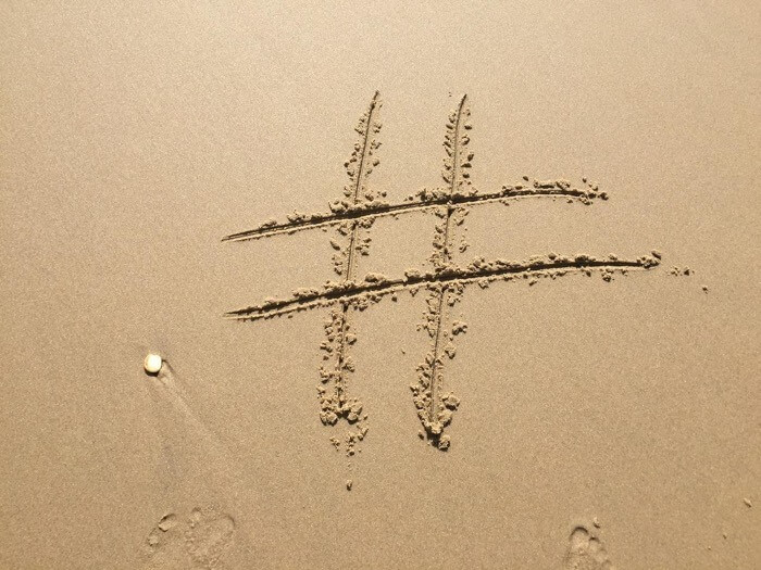 An image showing a hashtag encouraging to use social media wall