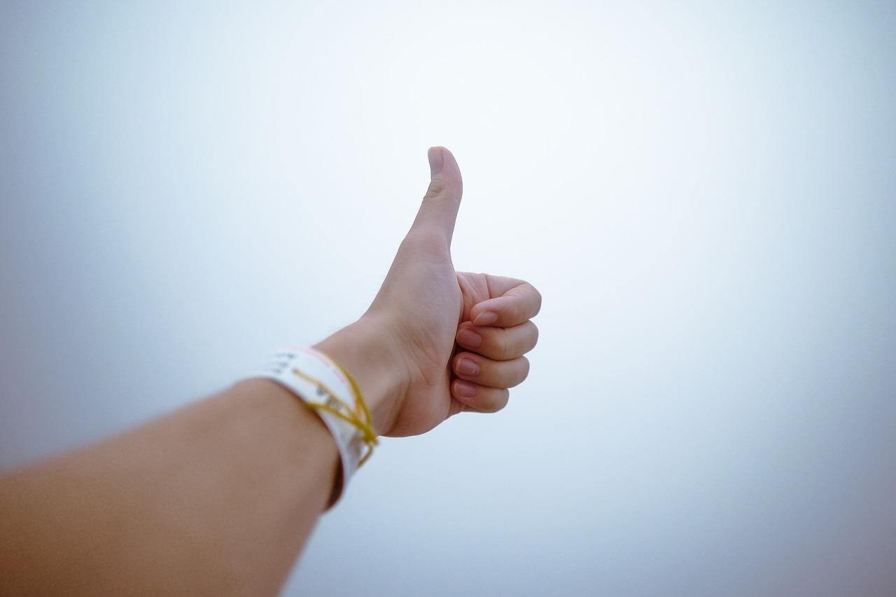 A thumb up as social proof one can show in a social media wall 